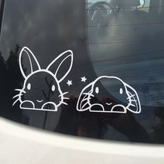 an image of a car window with rabbit stickers on it