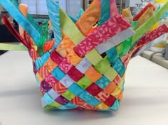 a colorful basket sitting on top of a table