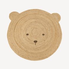 a brown bear shaped rug on a white background