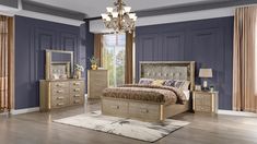 a bedroom scene with focus on the bed, dressers and mirror in the room