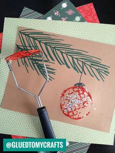 a christmas card being made with scissors and glue