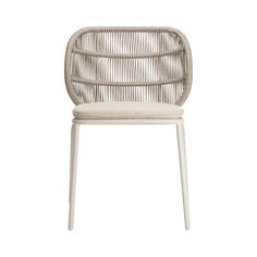 the white rattan chair is shown with an upholstered back and seat cushion