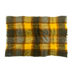 a yellow and grey plaid blanket on a white background