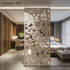 a room divider that has flowers cut out on it and is in front of a bed