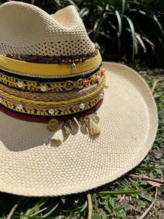 Hola and thank you for being part of our dream!  Here is very useful information before your purchase, but if you have any questions, do not hesitate to send us a message! Beautiful and colorful hats for women Handmade designed by Colombian artisan hands. It is exactly as shown in the pictures (It does include the decor on top) *SIZING* Size 3: 53-54cm Size 4: 55-56cm Size 5: 57-58cm Size 6: 59 +cm Please refer to the size measurement chart before ordering. You can find the measurement chart in the photos of our listing (all the way at the top). You will also find a guide that shows you how to take the correct measures. If you need additional photos or info to help you decide please message us! *GARMENT CARE* -Be sure to use only a damp cloth. A soaking wet cloth or sponge can cause water Handmade Wide Brim Toquilla Straw Fedora, Handmade Wide Brim Fedora In Toquilla Straw, Multicolor Wide Brim Panama Hat In Toquilla Straw, Multicolor Wide Brim Summer Fedora, Handmade Toquilla Straw Hat For Kentucky Derby, Multicolor Brimmed Fedora For Vacation, Handmade Fedora Hat Band From Toquilla Straw, Handmade Wide Brim Panama Hat In Toquilla Straw, Multicolor Bohemian Straw Hat For Kentucky Derby