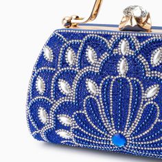 Introducing the Augustine Pearls Handbag - an enchanting masterpiece crafted to elevate your evening attire to unprecedented levels of sophistication. This clutch exudes magnificence in every detail, adorned with shimmering rhinestones and delicate pearl accents. Remarkably lightweight, it guarantees seamless carrying all through the night without compromising on style. Now available in blue, black, silver, and red. Glamorous Pearl Embellished Rectangular Evening Bag, Bedazzled Rectangular Evening Bag For Parties, Handheld Evening Bags With Rhinestones, Glamorous Pearl-embellished Evening Bag For Events, Luxury Pearl-embellished Clutch Evening Bag, Luxury Pearl Embellished Clutch Bag, Luxury Pearl Embellished Clutch Evening Bag, Rhinestone Clutch For Events, Elegant Handheld Shoulder Bag With Rhinestones