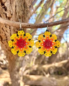 A beautiful pair of beaded earrings made by an artisan from the Wixárika/'Huichol' tribe of Western Mexico. Glass seed beads on stainless steel hooks. Yellow Bohemian Beaded Flower Earrings, Bohemian Flower-shaped Beaded Earrings For Gifts, Huichol Beaded Earrings, Yellow Flower-shaped Beaded Earrings, Bohemian Flower-shaped Earrings With Colorful Beads, Native Earrings, Earrings Flower, Glass Seed Beads, Flower Earrings