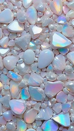 white and iridescent colored rocks are shown in close up