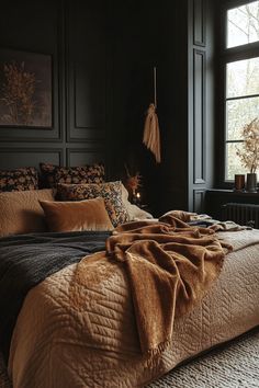 Velvet throws and patterned quilts adding texture to a dark boho bedroom. Dark And Moody Boho Bedroom, Dark Cozy Aesthetic Bedroom, Dark Academia Master Room, Rich Earthy Aesthetic, Green Brown Bedroom Ideas, Cozy Bedroom No Windows, Dark Walls Master Bed, Burgundy Boho Bedroom, Neutral Eclectic Bedroom