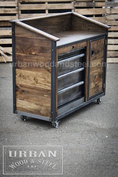 a wooden and metal cart sitting in front of pallets