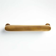 an old brass door handle on a white wall