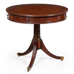 a round wooden table with two drawers on one end and an open drawer on the other side