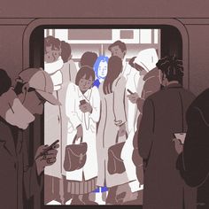 people are standing on the subway looking at their cell phones