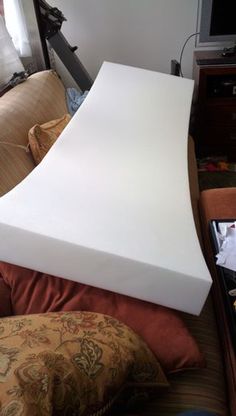 a mattress is sitting on top of a couch