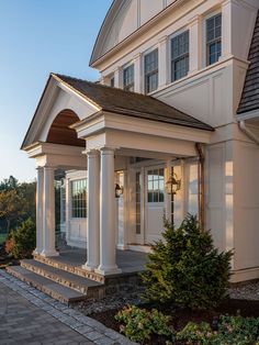 a large white house with columns and windows