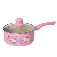 a pink pot with hello kitty on it and a wooden spoon in the bottom right hand corner