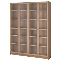 a wooden bookcase with glass doors on the front and bottom shelves in light wood