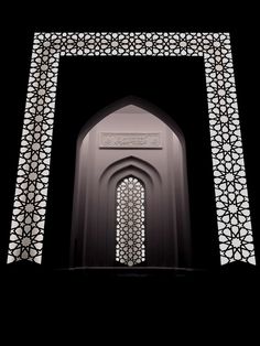 an arch in the middle of a building with intricate designs on it's sides