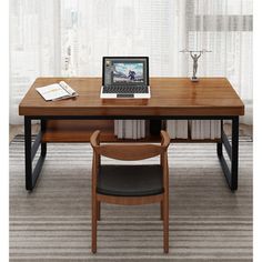 a laptop computer sitting on top of a wooden desk next to a chair in front of a window