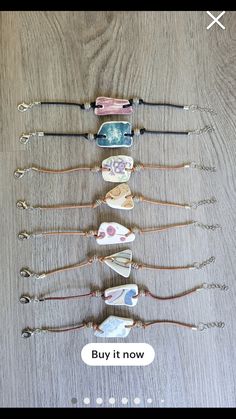 five different bracelets are lined up on a table