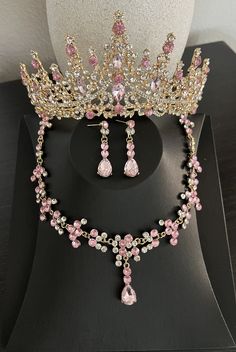 a pink tiara and necklace on display