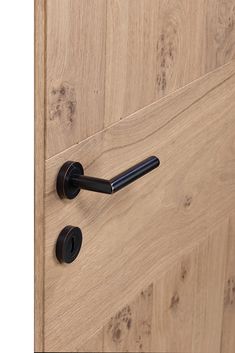 an open door with black handles and knobs