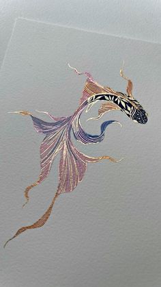 an artistic painting of a fish on the back of a white sheet with gold and purple designs