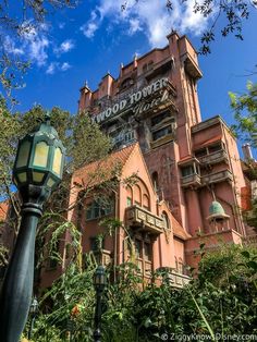 an old building with a sign on the front and side of it that says hollywood studios