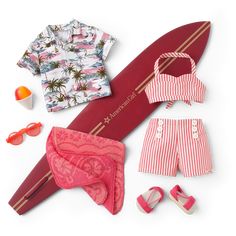 an assortment of clothing and accessories laid out on top of a surfboard next to sunglasses