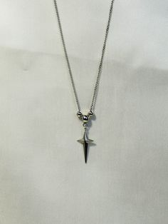 This celestial necklace features a faceted 4-pointed star and the same curb chain as the Genesis Necklace, and is the counterpart to the Starling Earrings. Its androgynous nature makes it the perfect piece for masculine, feminine, or any look in between.  The length of this necklace is adjustable, ranging from 49-58 cm. This piece is made entirely from stainless steel, making it hypoallergic, waterproof and tarnish-free. Feel free to wear it 24/7, in any conditions! Shipping information: The shi Starling, Masculine Goth, Alt Necklace, Goth Necklaces, Masculine Feminine, Celestial Necklace, Long Chain Necklace, Long Chain, Curb Chain