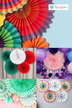 several different colored paper fans hanging on the wall