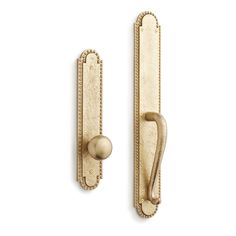 an antique brass door handle on a white background