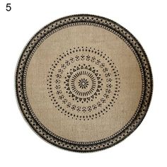 a round rug with black and white designs on the bottom, 5 feet in length