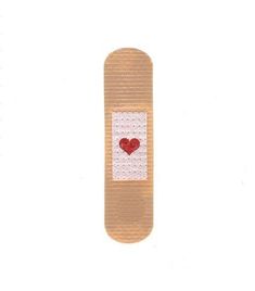 a red heart is placed on the back of a skateboard with white and brown trim