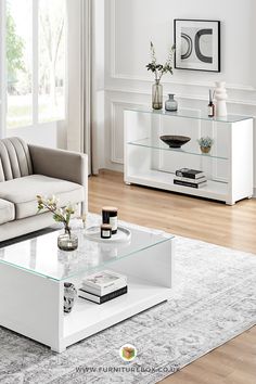 a modern living room with white furniture and wood floors