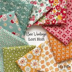 many different colors and patterns of fabric with the words bee vintage lori holt on it