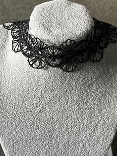 Elevate your style with this stunning gothic black lace floral necklace choker. Perfect for any occasion, this necklace is a must-have for those who want to add a touch of elegance to their look. The lobster closure ensures a secure fit, while the unknown metal and base metal add a touch of mystery to this beautiful piece. This necklace is perfect for those who love antique and vintage jewellery, but with a modern twist. The black lace and gothic theme make it unique and striking, while the cust Gothic Theme, Gothic Themes, Lace Choker Necklace, Lace Choker, Floral Necklace, Necklace Choker, The Unknown, Vintage Jewellery, Base Metal