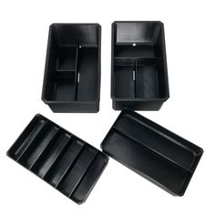 three black trays with dividers on white background