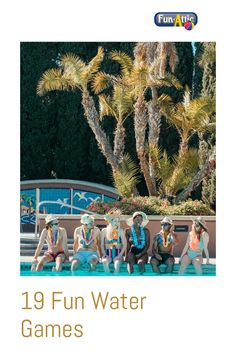 a group of people sitting next to each other on top of a swimming pool with palm trees in the background