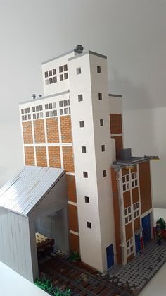 a building made out of legos sitting on top of a table