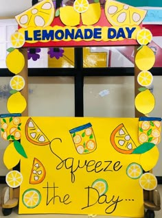 a lemonade day sign is displayed in front of a classroom door that reads squeeze the day