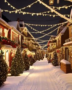 a street covered in christmas lights and decorated with garlands on both sides, surrounded by snow