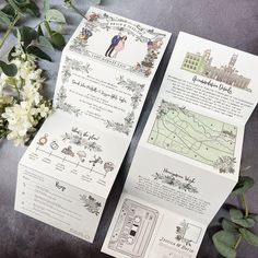 wedding stationery with flowers and greenery laid out on the floor next to each other