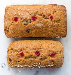 two loafs of fruit bread sitting on top of a counter