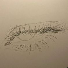 a drawing of an eye with long lashes