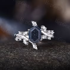 Longe Hexagon Galaxy Blue Sandstone Leaf Engagement Ring,Silver White Gold Moissanite Ring,Natural Inspired Bridal Ring,Galaxy Jewelry Gift Blue Sandstone looks black when you see it from a distance. When you look closely at it, you will see countless blue-purple grains on it. Blue Sandstone is a gemstone that has the meaning and properties of improving money luck. It holds the power to lead the business of the owner to success. It is also recommended when the owner aims to expand assets. It is Black Sandstone Ring, Blue Goldstone Engagement Ring, Constellation Engagement Ring, Galaxy Ring Engagement, Blue Sandstone Engagement Ring Silver, Silver Octagon Crystal Promise Ring, Silver Octagon Sapphire Ring For Anniversary, Silver Octagon Sapphire Ring With Diamond, Silver-toned Octagon Sapphire Ring With Diamond