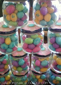 several jars filled with candy sitting on top of a table