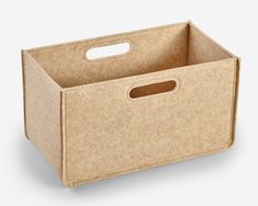 an empty cardboard box with handles on a white background, it is also used for storage