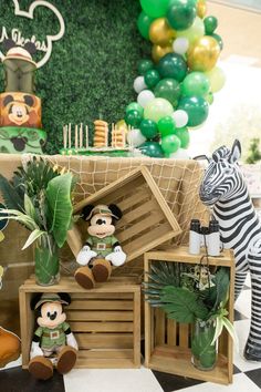 an animal themed birthday party with balloons and decorations