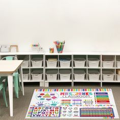 a classroom area with desks, chairs and storage bins on the floor next to each other